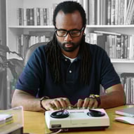Adult African American male using TTY equipment.
